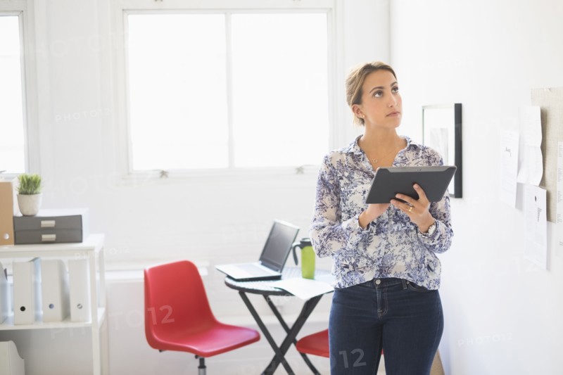 Young woman working in office.