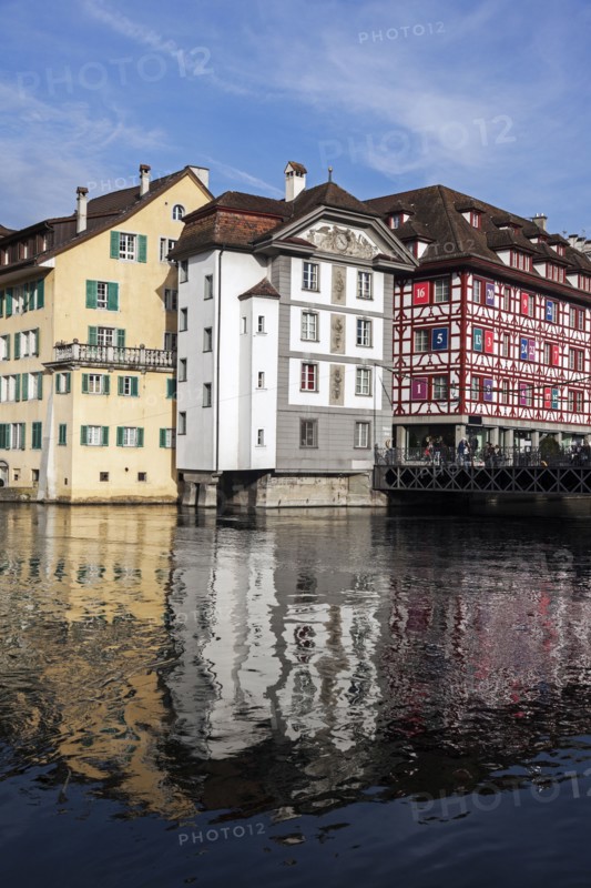 Townhouses reflecting in water