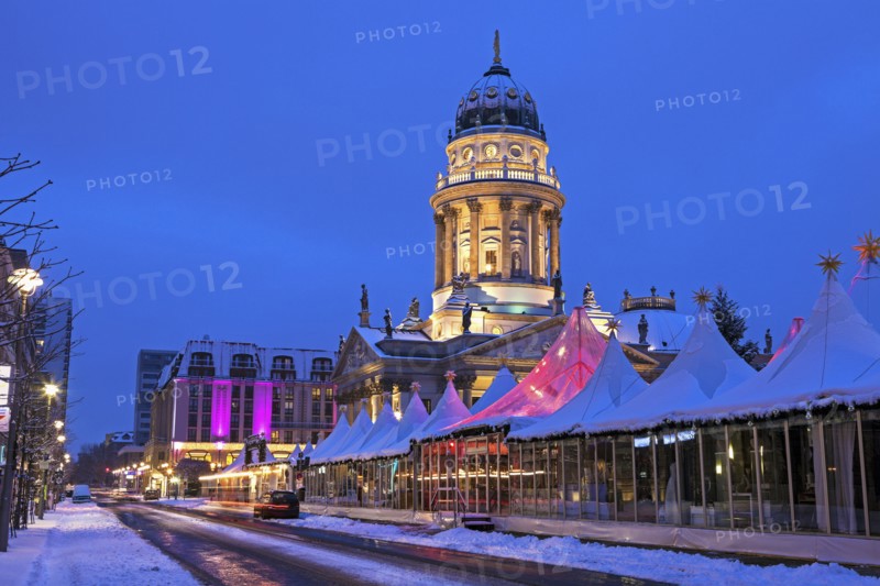 Christmas Market and illuminated steeple of French Cathedral