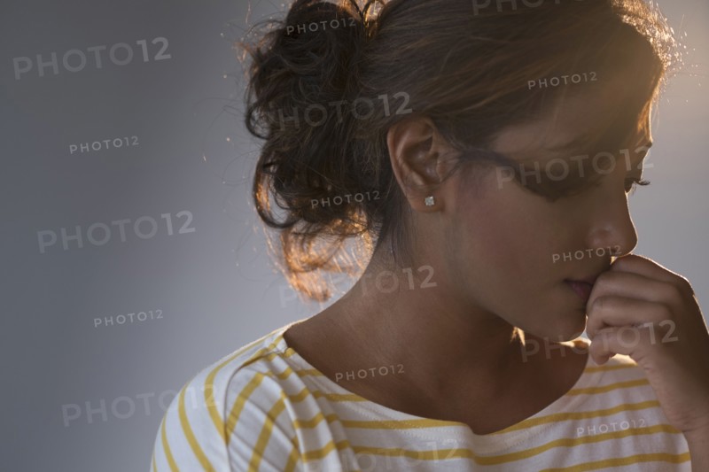 Portrait of young woman in studio.