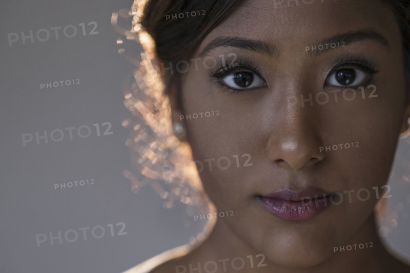 Portrait of young woman in studio.