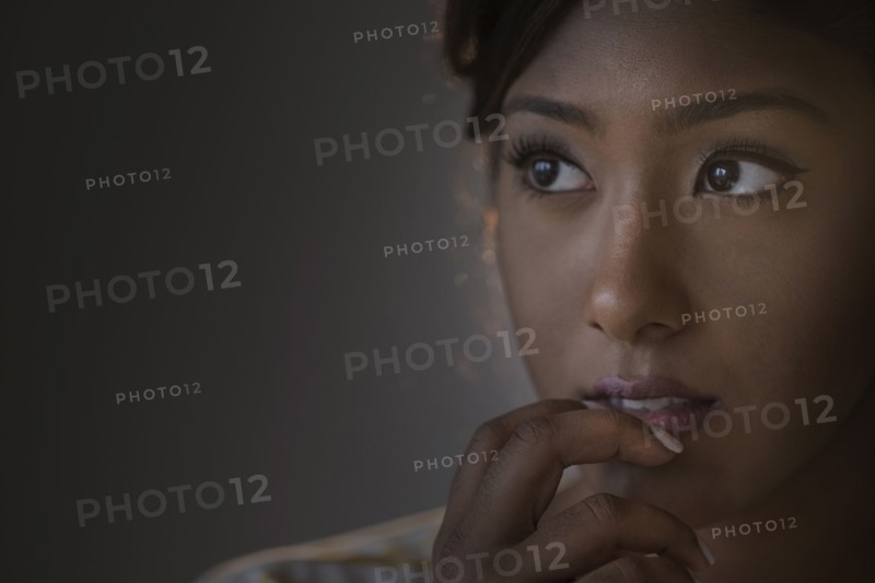 Portrait of young woman in studio.