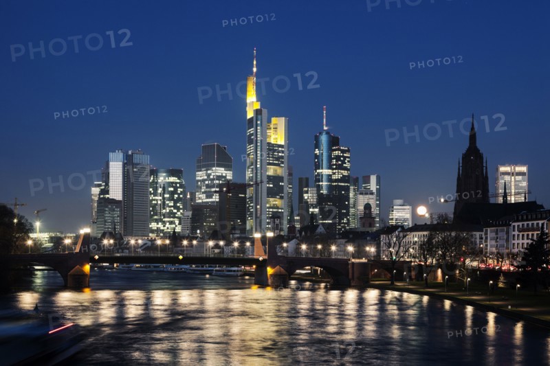 Illuminated riverfront skyline