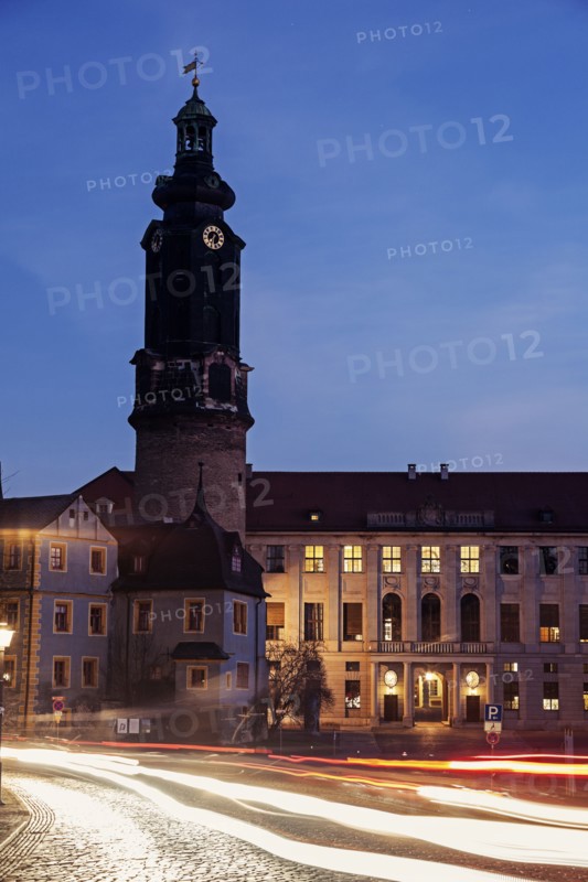 Light trails and clock tower at night