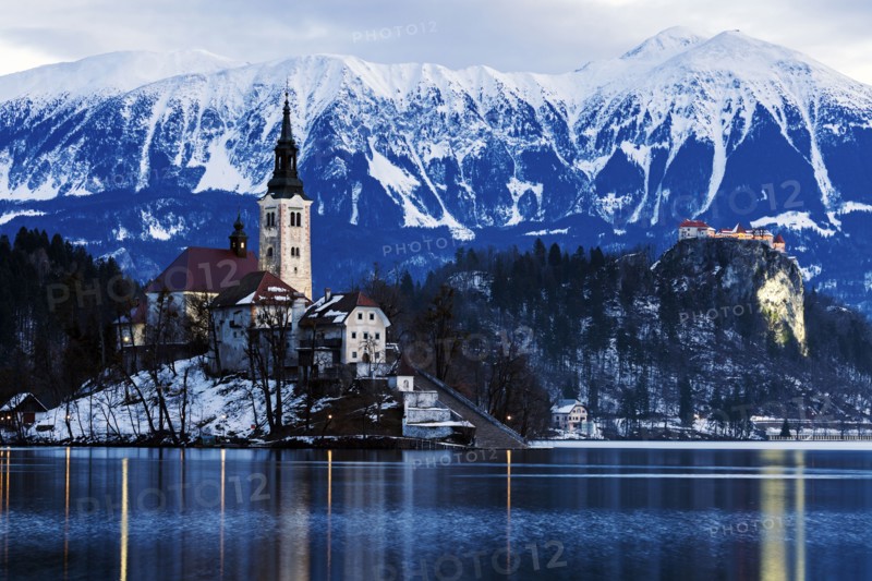 View of Church of the Assumption with lake and mountain