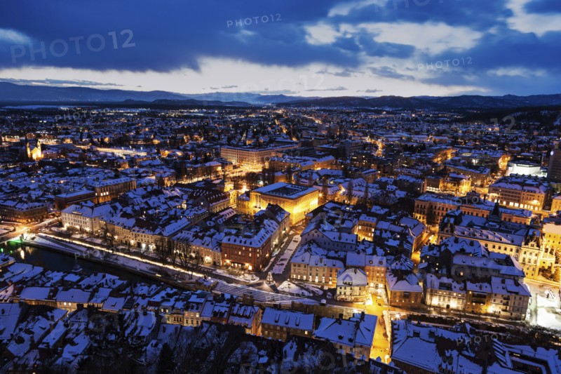Illuminated cityscape at dusk