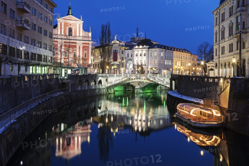 Illuminated buildings and Ljubljanica River