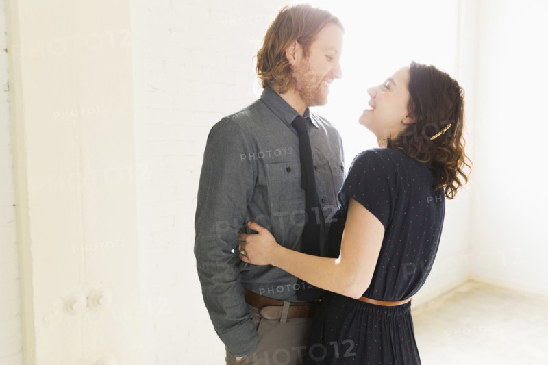 Smiling couple embracing