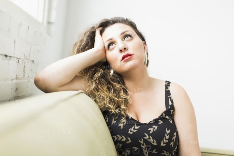 Woman looking up and daydreaming