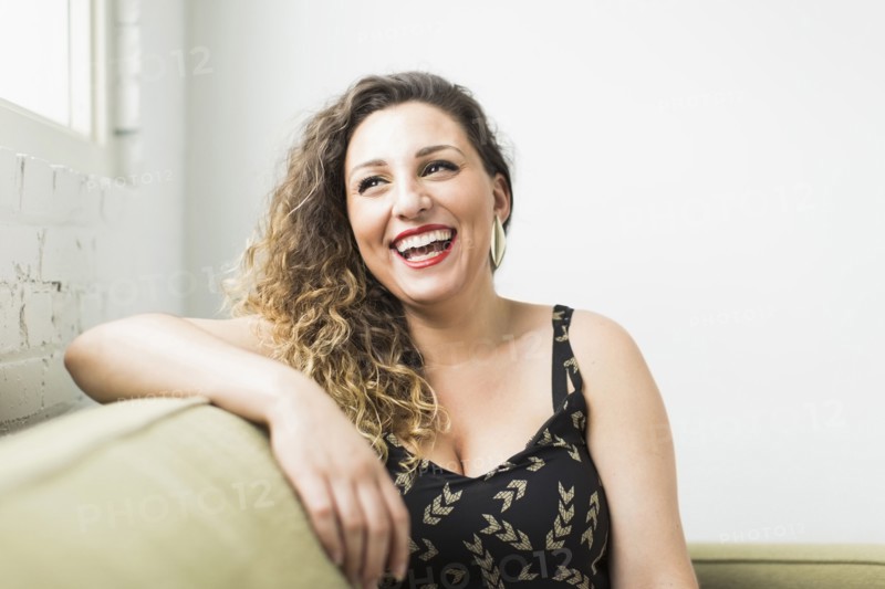 Woman looking away and laughing