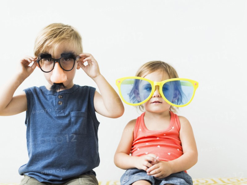 Children (2-3) wearing novelty glasses