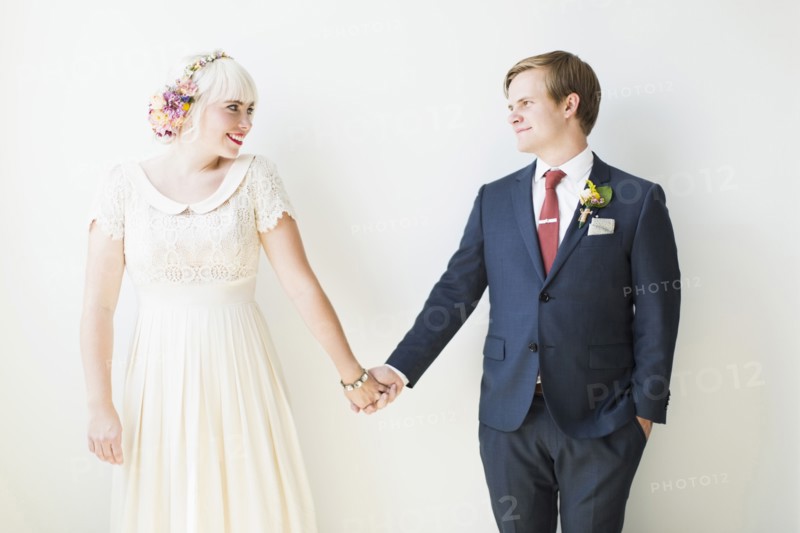 Smiling newlywed couple in studio