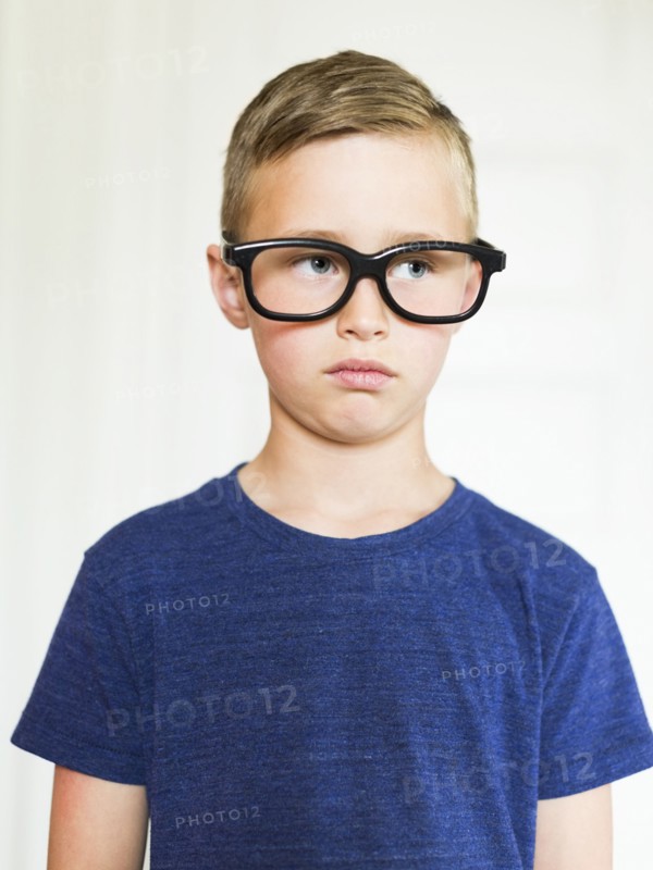 Portrait of boy (6-7) wearing eyeglasses