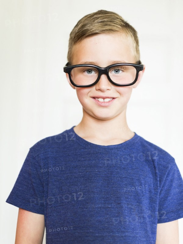 Portrait of boy (6-7) wearing eyeglasses