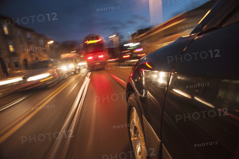 Car speeding along railroad tracks