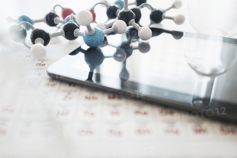 Periodic table on desk.