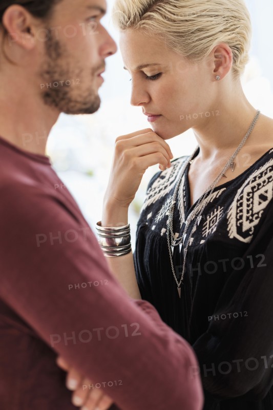 Couple arguing in living room.