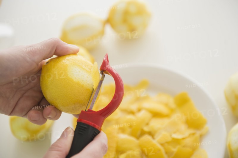 Personal point of view of person peeling lemons