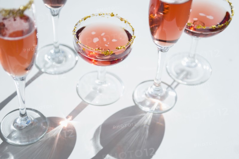 Different wine glasses on white