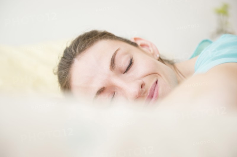 Woman smiling in sleep