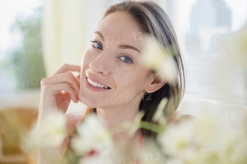 Portrait of smiling woman at home