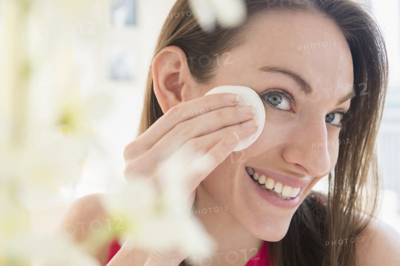 Woman using cotton pad