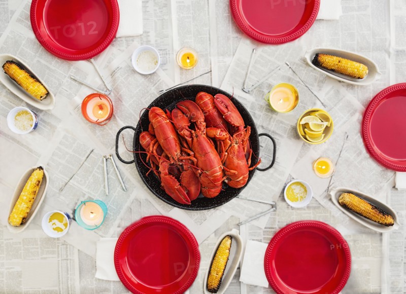 Plate with lobsters on dining table