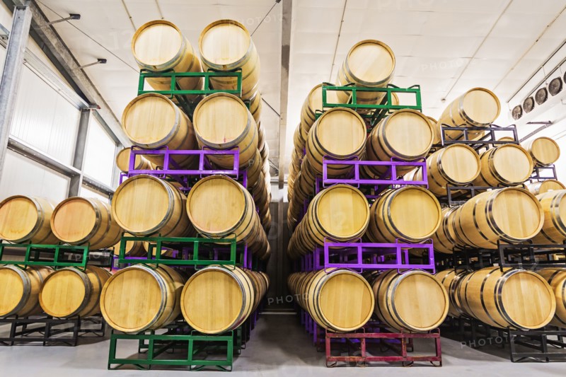 Wine barrels on racks in cellar