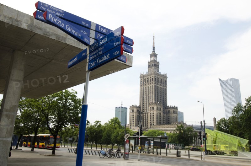 Sign post with Palace of Culture and Science in background