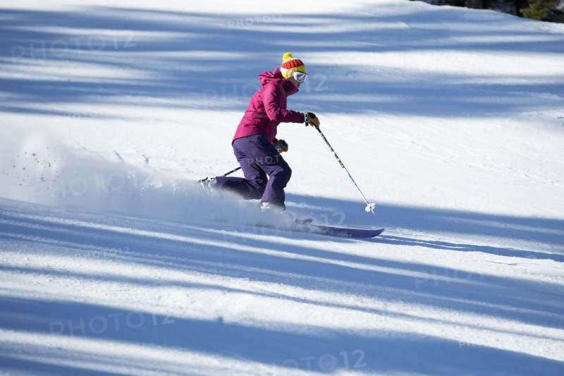 Woman skiing downhill
