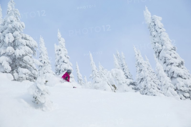 Low angle view of mature woman on ski slope