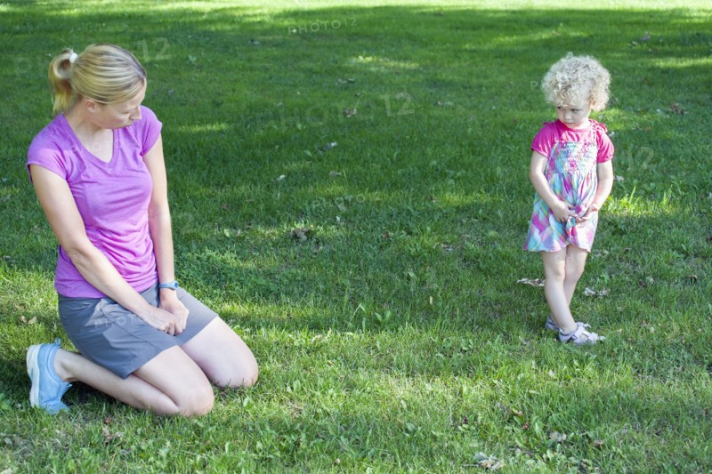 Mother copying daughter's (4-5) facial expression