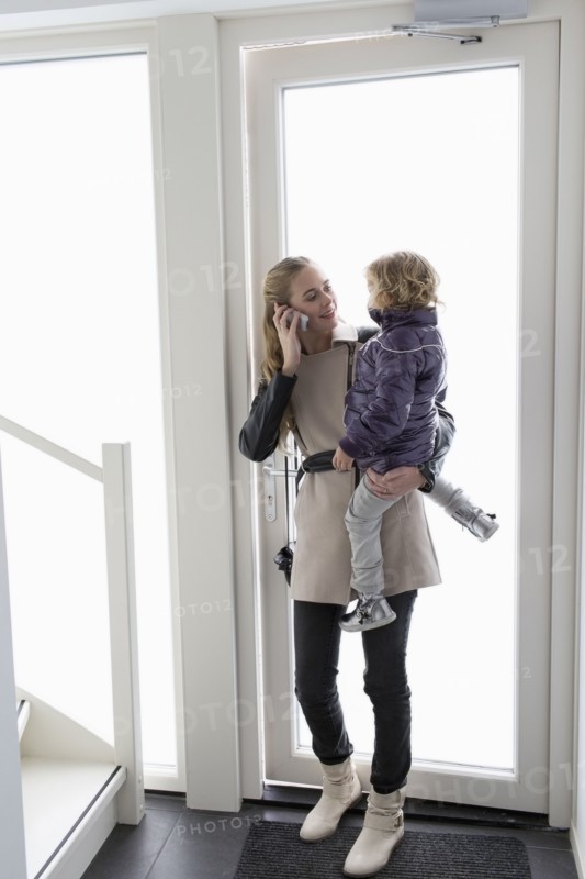Mother holding son (4-5)