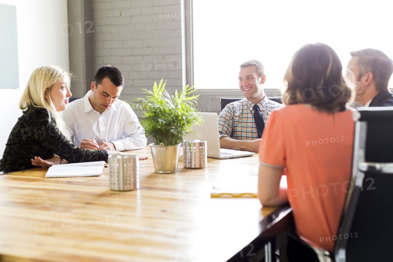 Five office workers during meeting