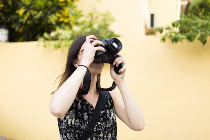 Woman taking photos during vacations