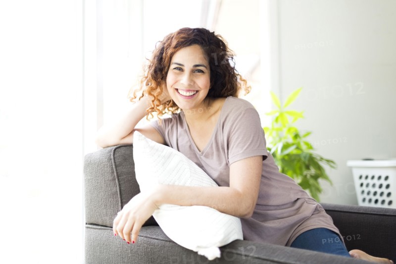 Woman sitting on sofa