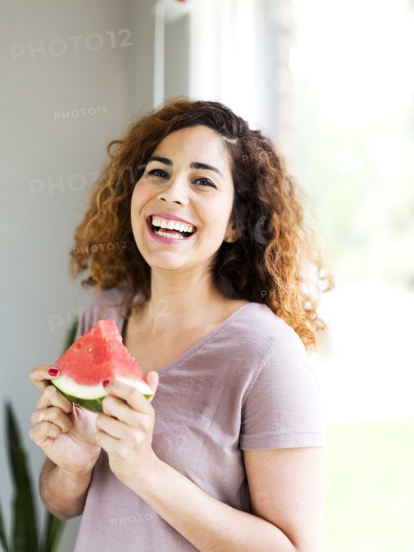 Woman holding water melon