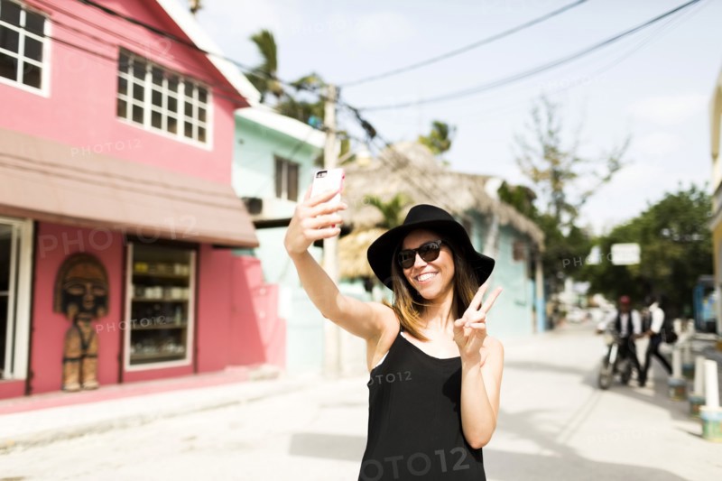 Woman photographing self