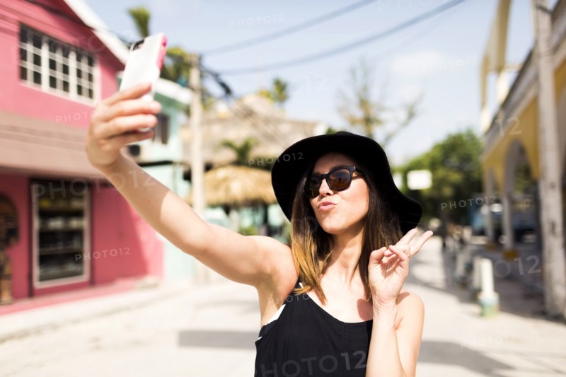 Woman photographing self