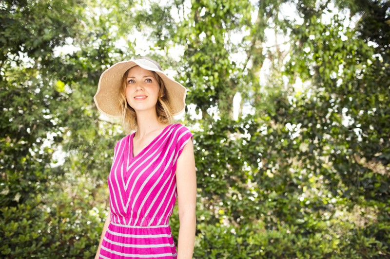 Woman standing by trees