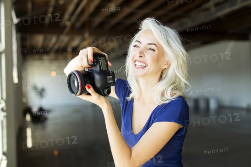 Woman using digital camera