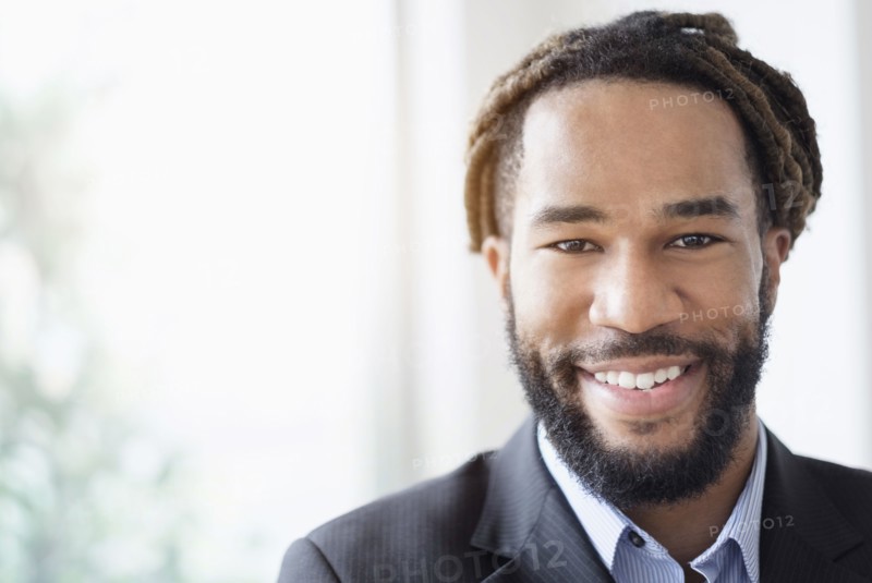 Portrait of smiley businessman wearing suit.