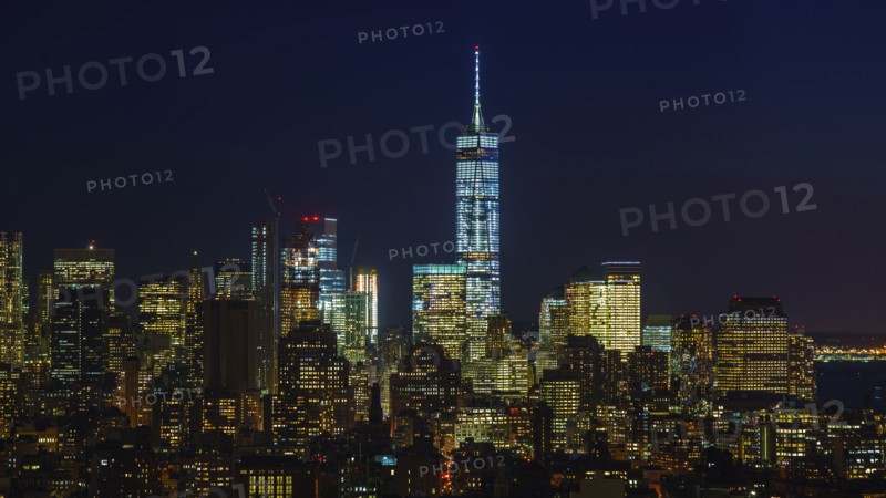 Illuminated cityscape at night. New York City, New York, USA.