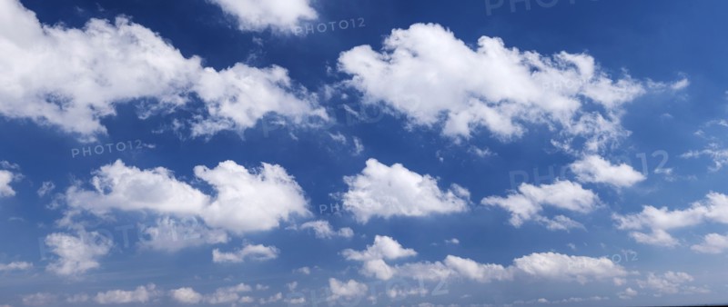 Clouds against blue sky.