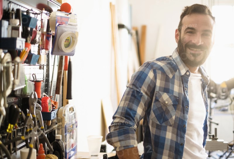 Portrait of man in workshop.
