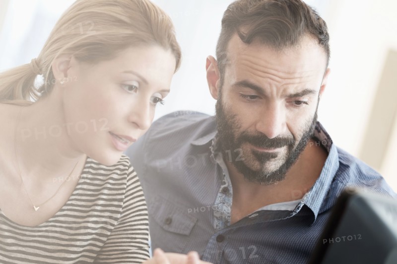 Man and woman looking at computer.