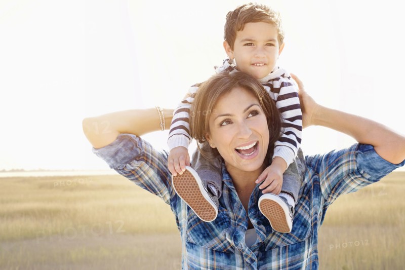 Woman playing with son (2-3).