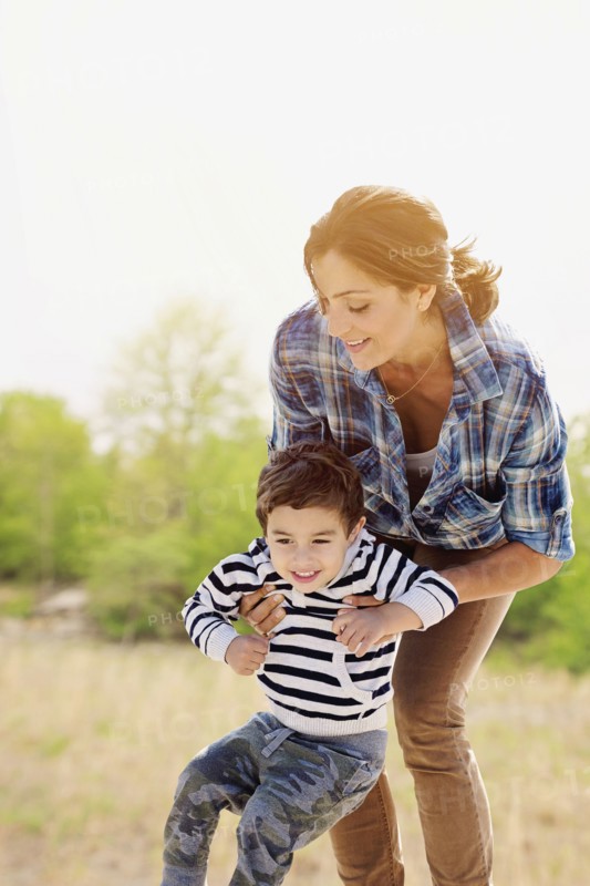 Woman playing with son (2-3).