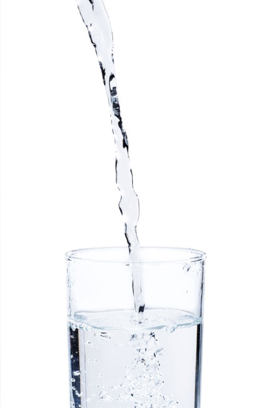 Studio shot of water pouring into glass.