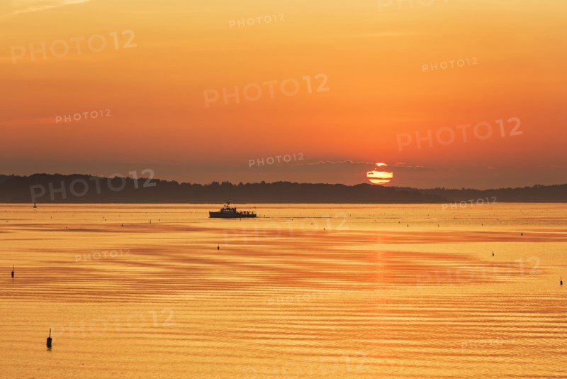 Lobstermen fishing in golden sunrise